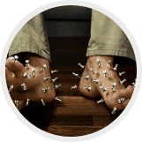 Icon illustrating the pins-and-needles sensation in the feet associated with peripheral neuropathy